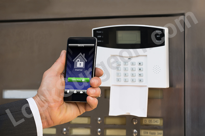 Commercial alarms & security control with smartphones installed and sold by Lock Surgeon Acheson