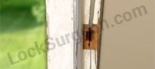 Broken residential door needing repair Airdrie.