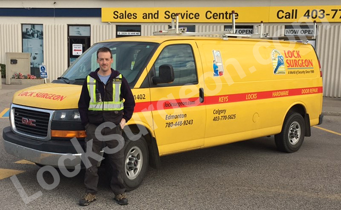 Home handle deadbolt repair Calgary apprentice Phil with service van.