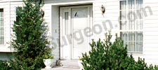 White house with new storm door on the front Calgary.