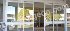 Open glass sliding door on an industrial commercial building.